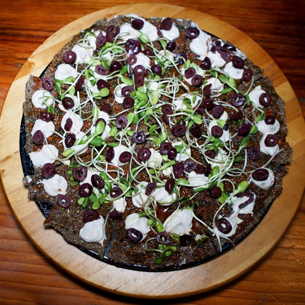 GLUTEN FREE RAW DIVEGAN KETO PIZZA WITH KALAMATA OLIVES